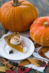 Delectable Sliced Pumpkin Pie on White Ceramic Plate